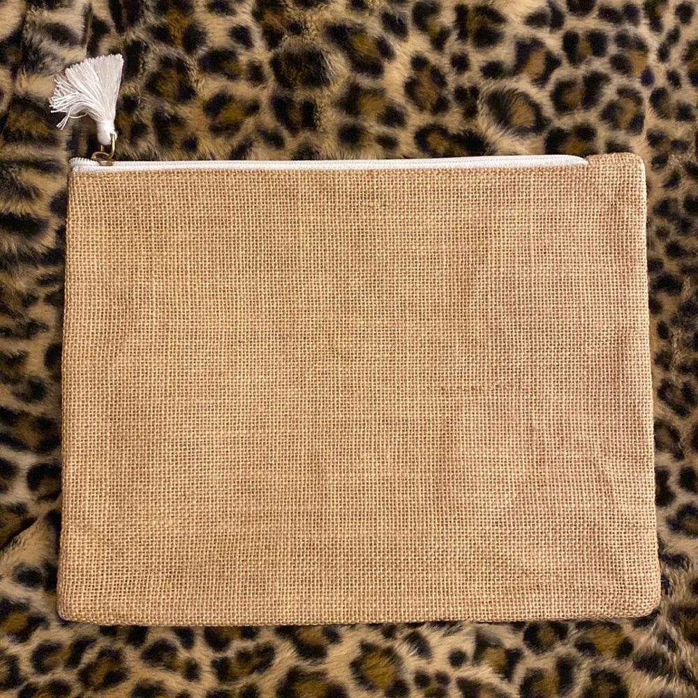 NWOT Mudpie tweet pouch lined with waterproof plastic inside.